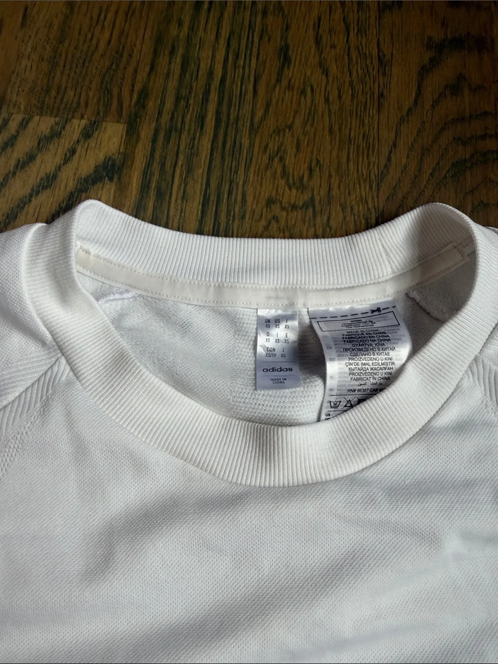 adidas White Short-Sleeve Tennis Shirt with Navy Logo